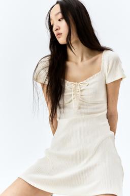 Lace-Trimmed Dress with Flared Skirt