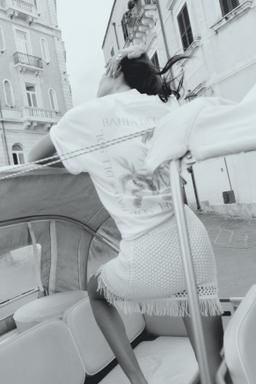 Fringe-trimmed pointelle-knit skirt