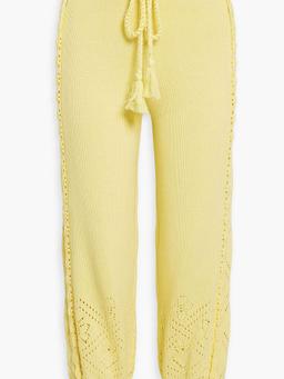 Nyla tasseled crochet-knit cotton track pants